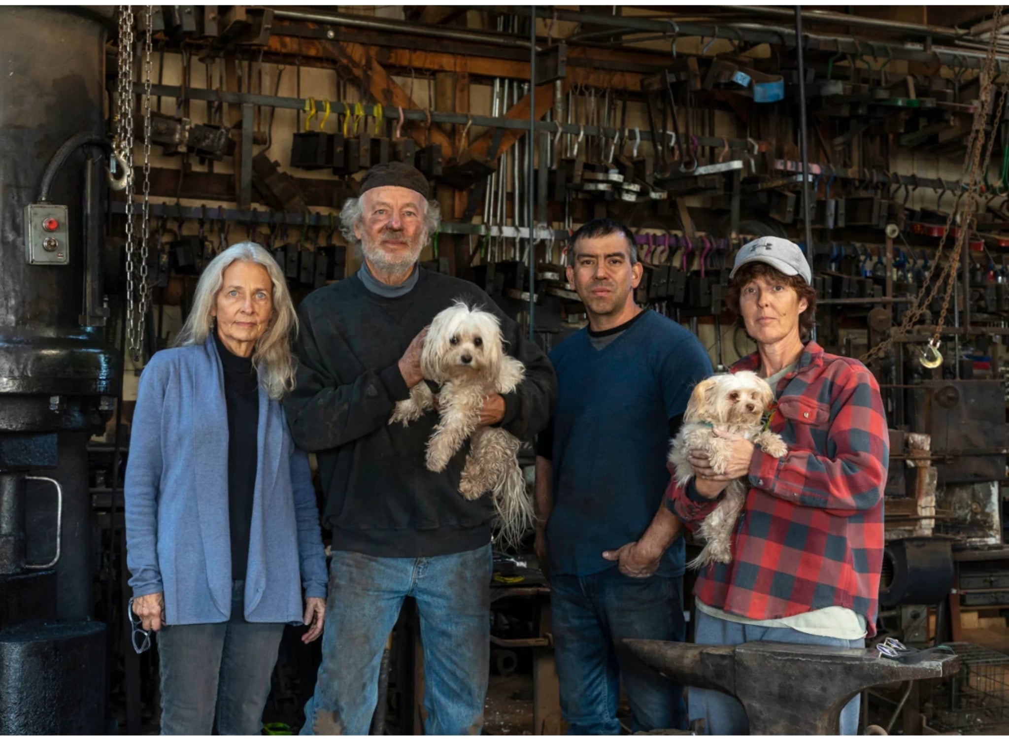 Christopher Thomson Ironworks employee team and their two dogs.