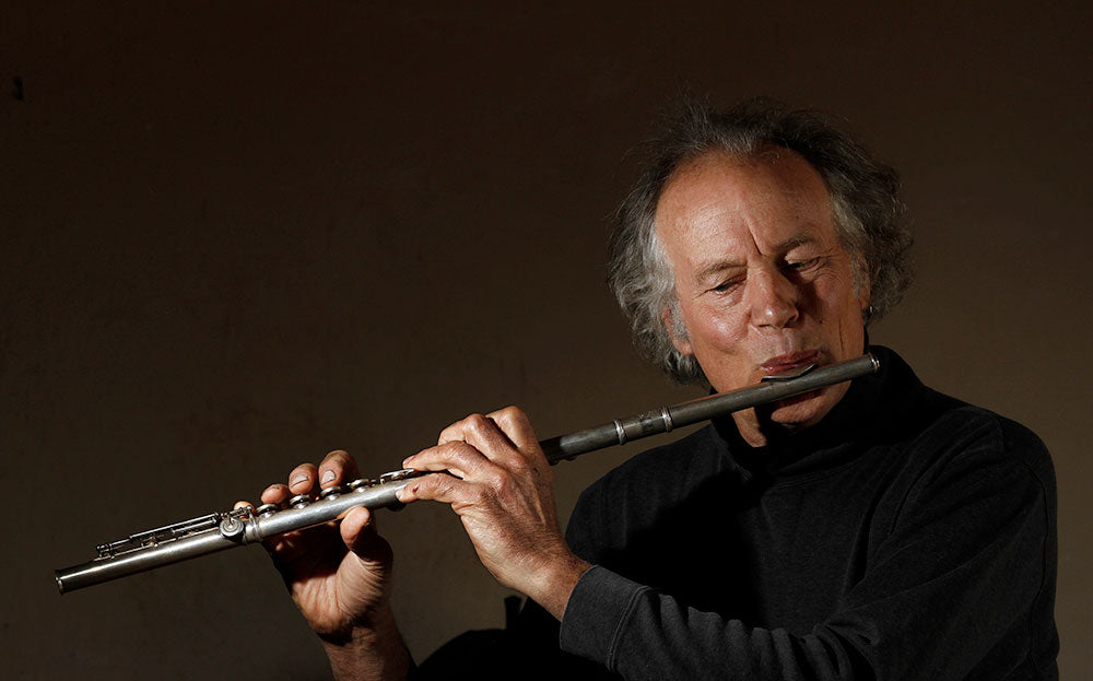 Blacksmith, Christopher Thomson, playing the flute.