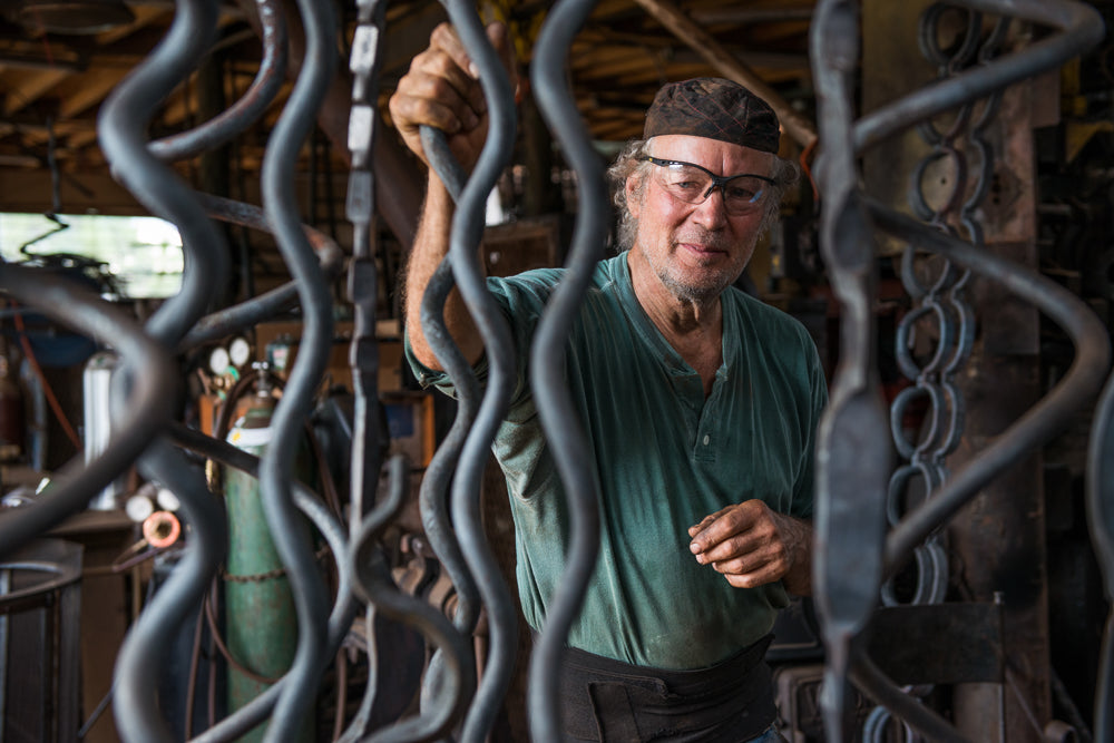 Portrait of Christopher Thomson in his blacksmith shop.