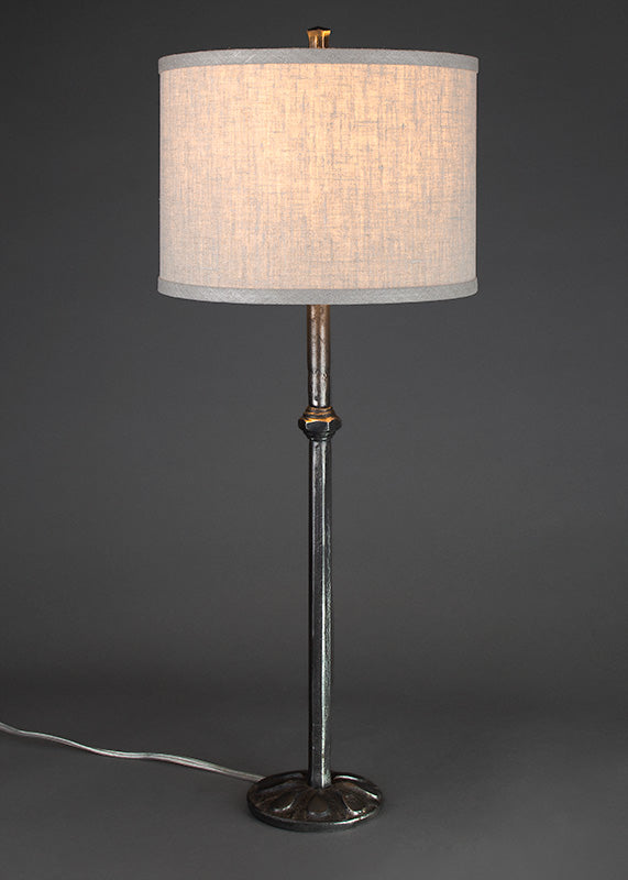 Wrought Iron Etruscan Lamp with a woven linen drum shade.