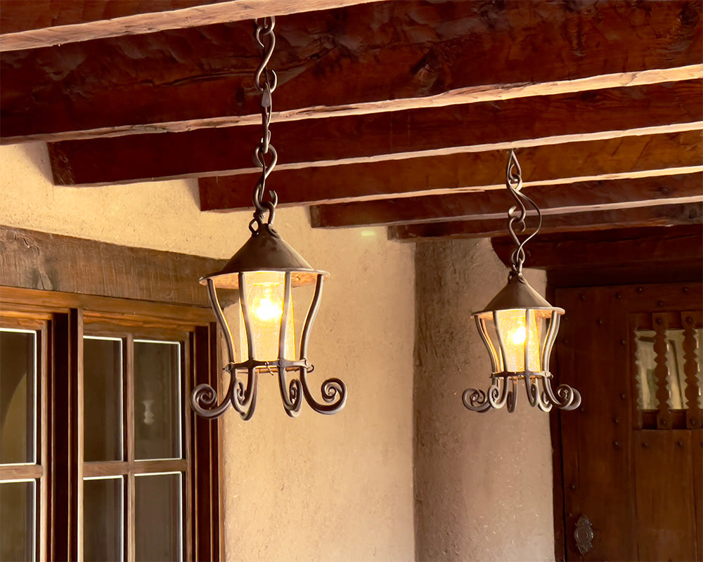 Two large hanging wrought iron lanterns.