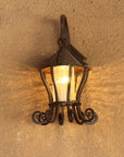Hanging Iron Wall Lantern on an adobe wall.