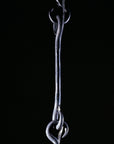 Long hook chain link made out of hand forged steel.