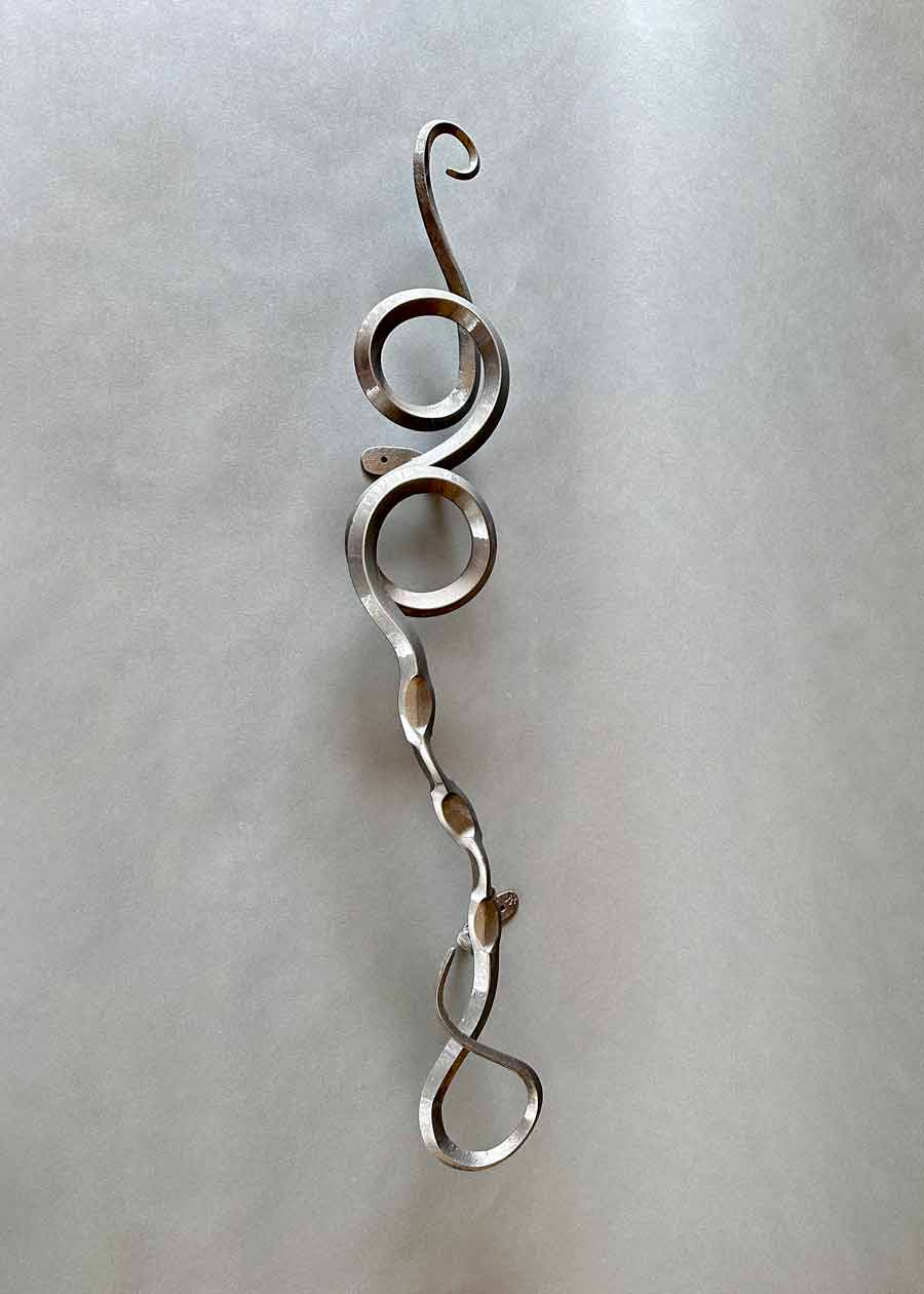 Metallic iron wall sculpture.