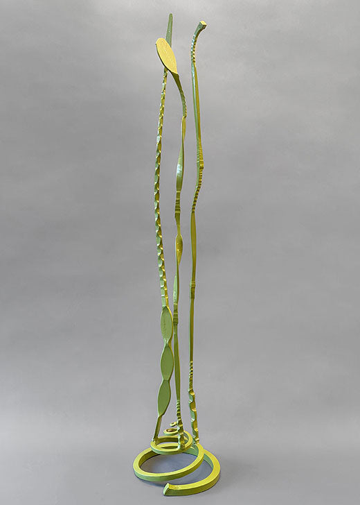 Baby Pajo wrought iron sculpture that is painted with a pea green powdercoat.