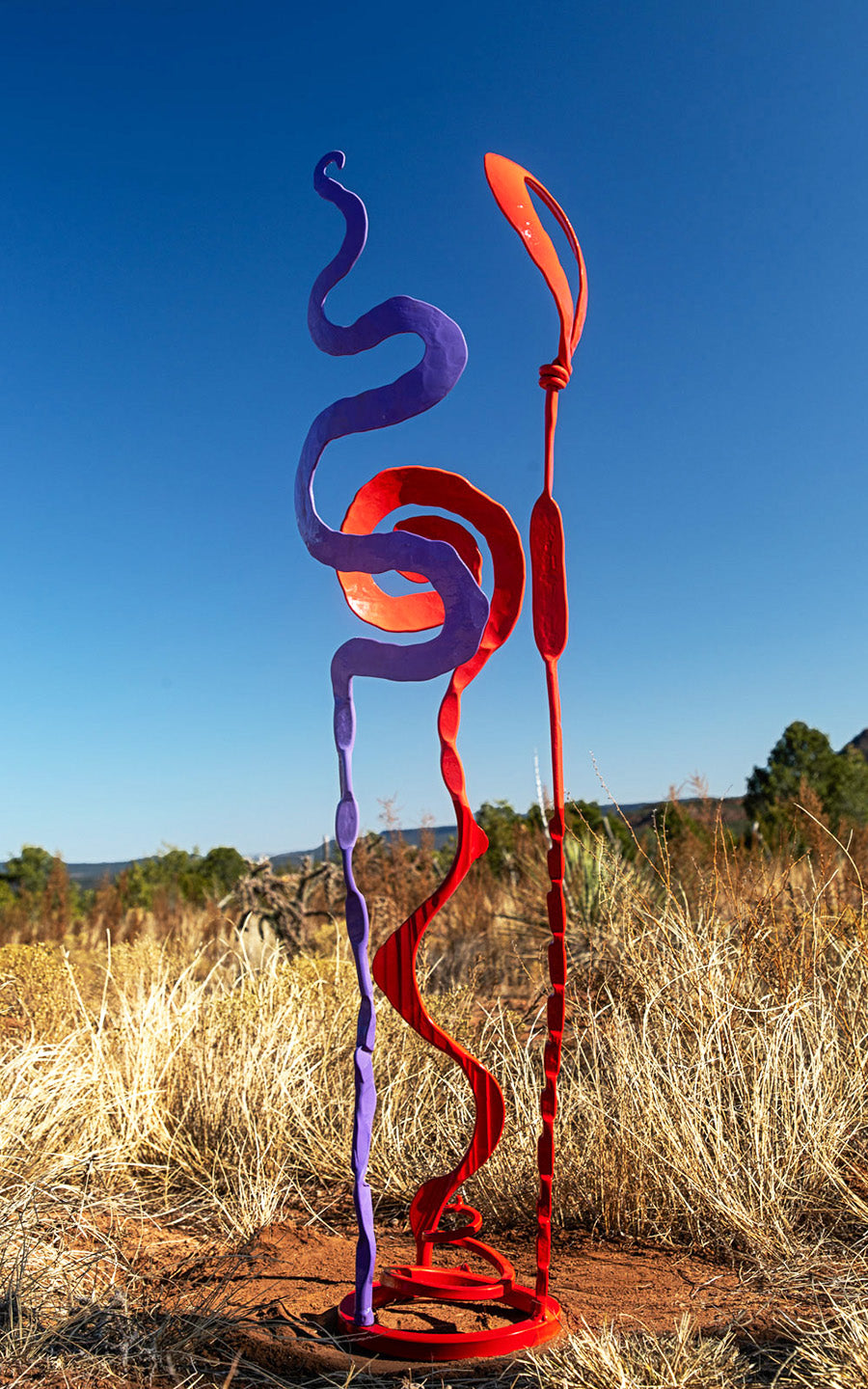 Red and purple Baby Bloom steel sculpture.