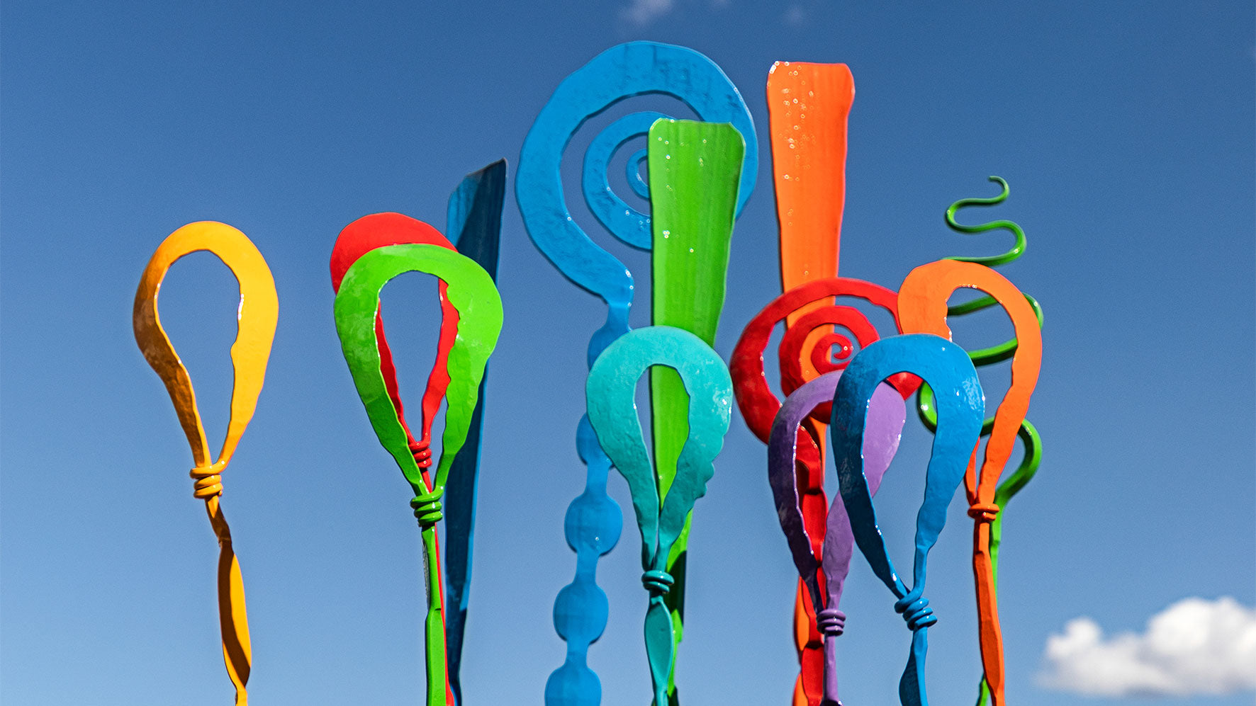 Colorful sculpture forms; decorative banner.