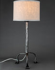 Simply Santa Fe wrought iron lamp shown with a linen drum shade.