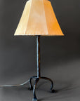 Wrought Iron bedside Simply Santa Fe lamp with a raw hide sheepskin shade.