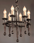 Old world style wrought iron chandelier. Small Rustic Fleur Chandelier by Christopher Thomson.