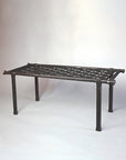 Handcrafted woven wrought iron bench by artisan blacksmith Christopher Thomson. This decorative ironwork bench features intricate woven metalwork and a durable, artistic design, perfect for indoor or outdoor use in luxury spaces. An elegant blend of traditional blacksmith techniques and modern metal forging craftsmanship.