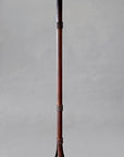 Rustic wrought iron floor lamp made from hand forged steel and paired with a woven linen shade.