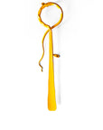 Abstract minimalist wall sculpture with a loop on one end and a feather like shape on the other. Powder-coated with yellow paint.