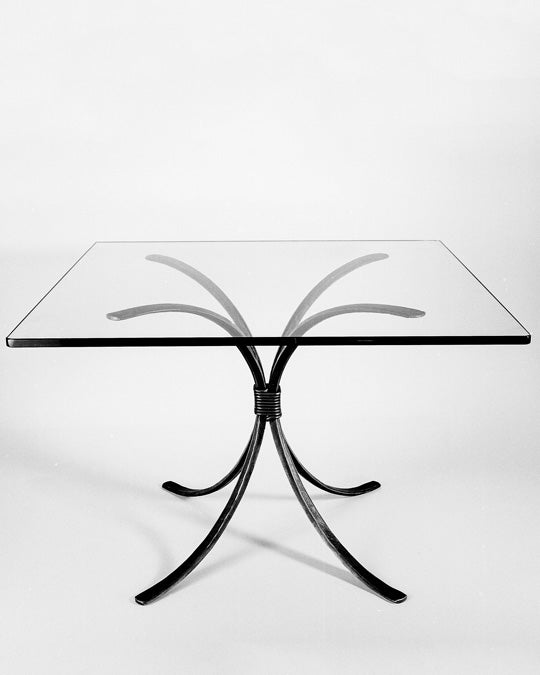 Square wrought iron dining table by blacksmith, Christopher Thomson. Shown with a rectangular glass top.