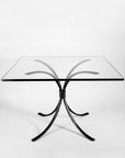 Square wrought iron dining table by blacksmith, Christopher Thomson. Shown with a rectangular glass top.