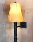 Hinged Torch Iron Wall Sconce shown with a Sheepskin Shade.