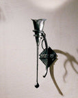 Large Calla Wall Sconce w/ Tendril with a hammered calla lily that supports the candle and bulb.