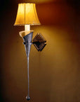 Large Calla Lily Iron Wall Sconce with a sheepskin shade.