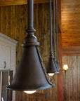 Four large wrought iron Ceiling Pendant Lights hanging from the ceiling in a row