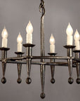 Rustic Fleur Wrought Iron Chandelier made from hand forged steel. Features six torches with candle lightbulbs.