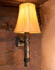 Forged Steel light fixture, Stationary Torch Wrought Iron Wall Sconce, shown with a Sheepskin Shade.