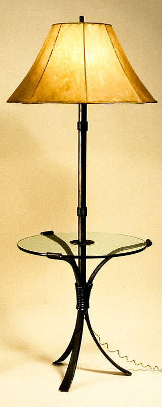 Wrought Iron Lamp Table shown with a raw hide sheepskin shade. The floor lamp extends out of the center of the table, serving as a table/lamp combo.