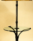 Wrought Iron Lamp Table shown with a raw hide sheepskin shade. The floor lamp extends out of the center of the table, serving as a table/lamp combo.