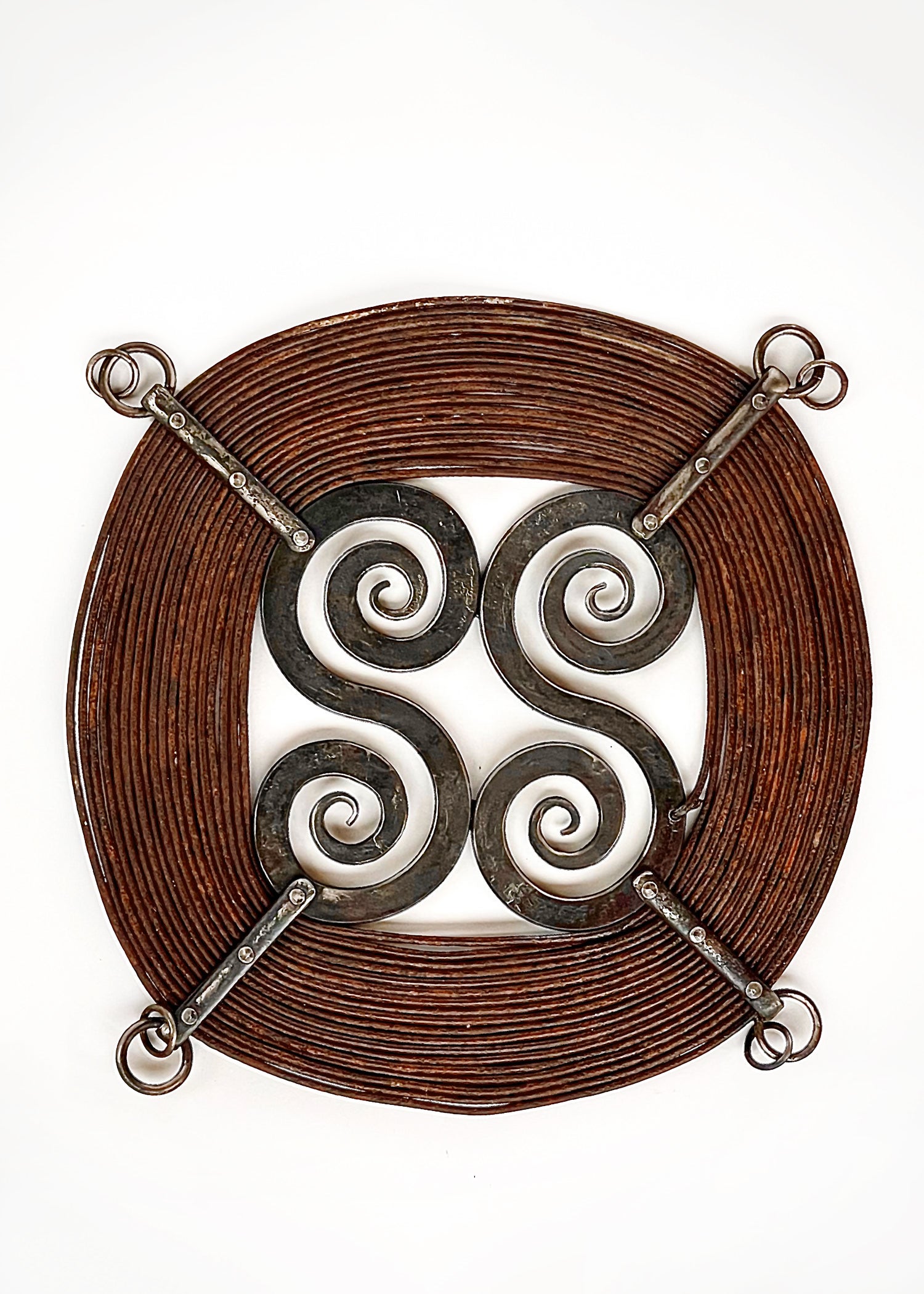 "Windings" forged steel sculpture with a rust finish.