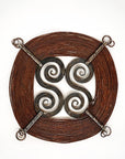 "Windings" forged steel sculpture with a rust finish.