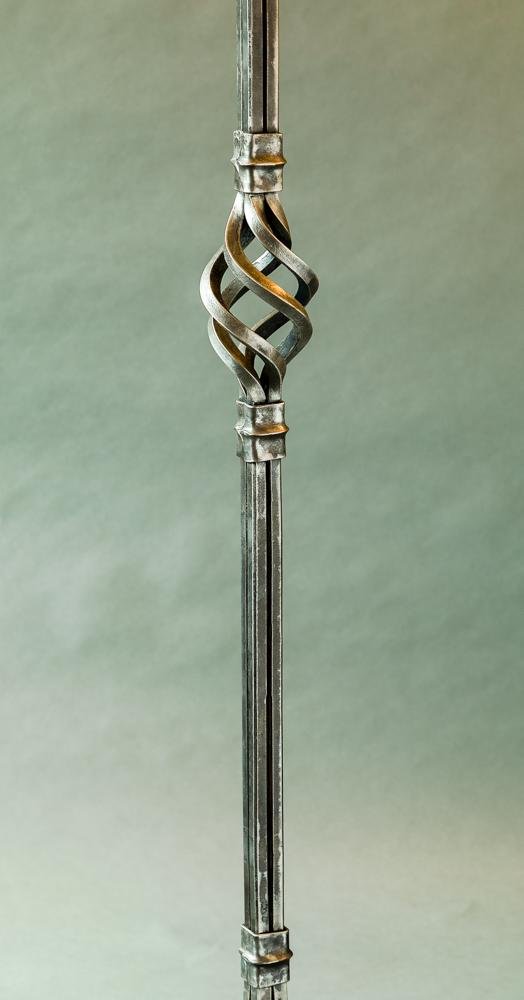 Hand forged detail of decorative wrought iron work on Christopher Thomson's Standing Coat Rack.