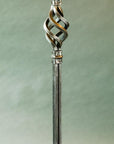 Hand forged detail of decorative wrought iron work on Christopher Thomson's Standing Coat Rack.
