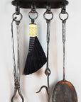 Wall Mounted Fireplace Tool Set with four hand forged wrought iron fire tools.