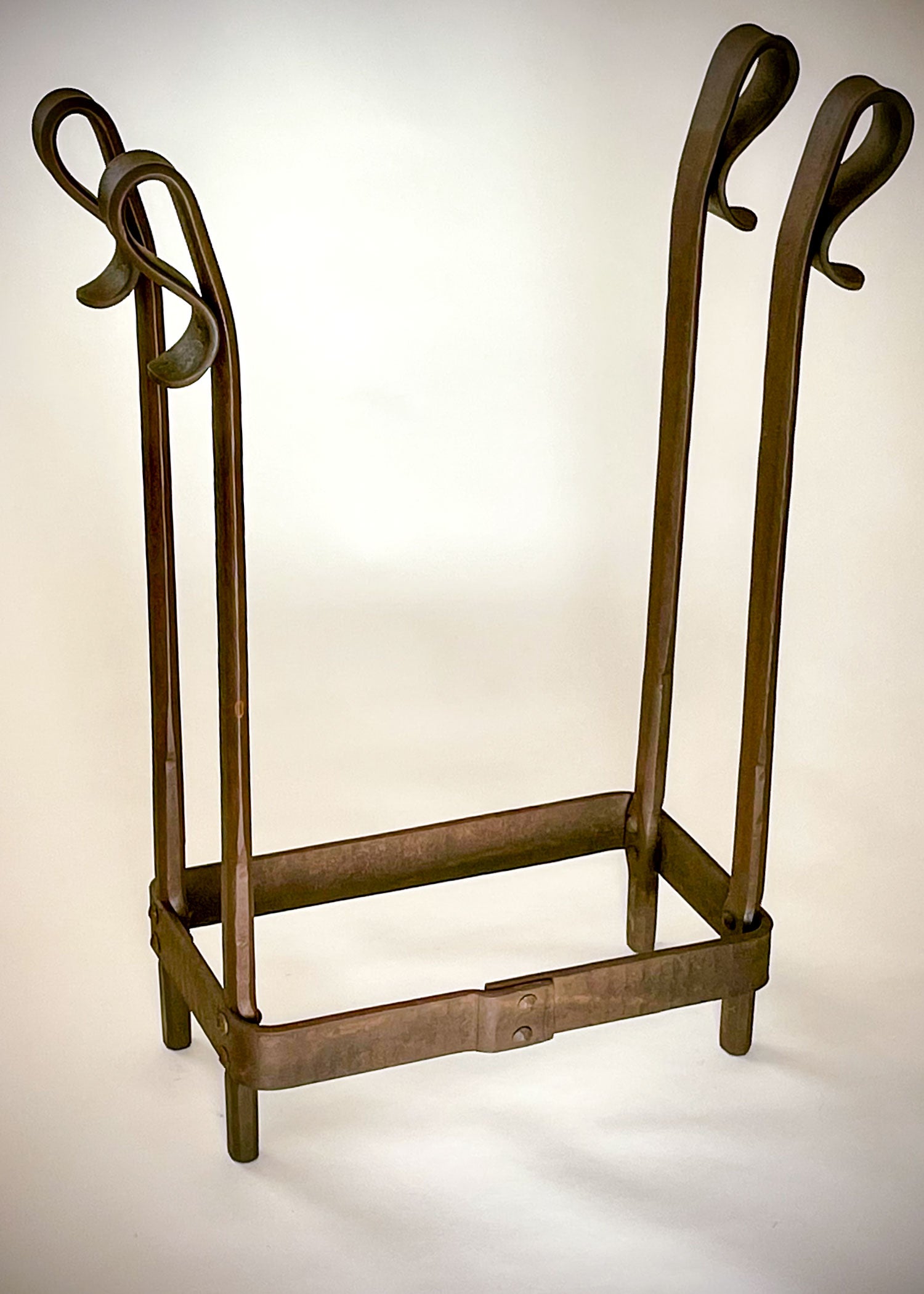Wrought iron log holder, size medium, rust finish.