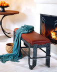 Rustic Wrought Iron Vessel Bench by Christopher Thomson shown with a Pewter Black finish in front of a fireplace.