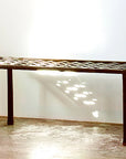Woven Wrought Iron Bench made with long strands of woven forged steel.