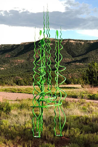 Large green steel sculpture by Christopher Thomson Ironworks called Spiral Blooms #6.