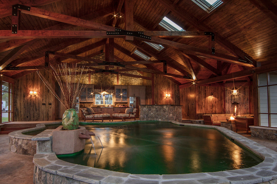 Indoor Koi pond at a mansion, lit entirely with wrought iron light fixtures by blacksmith, Christopher Thomson.