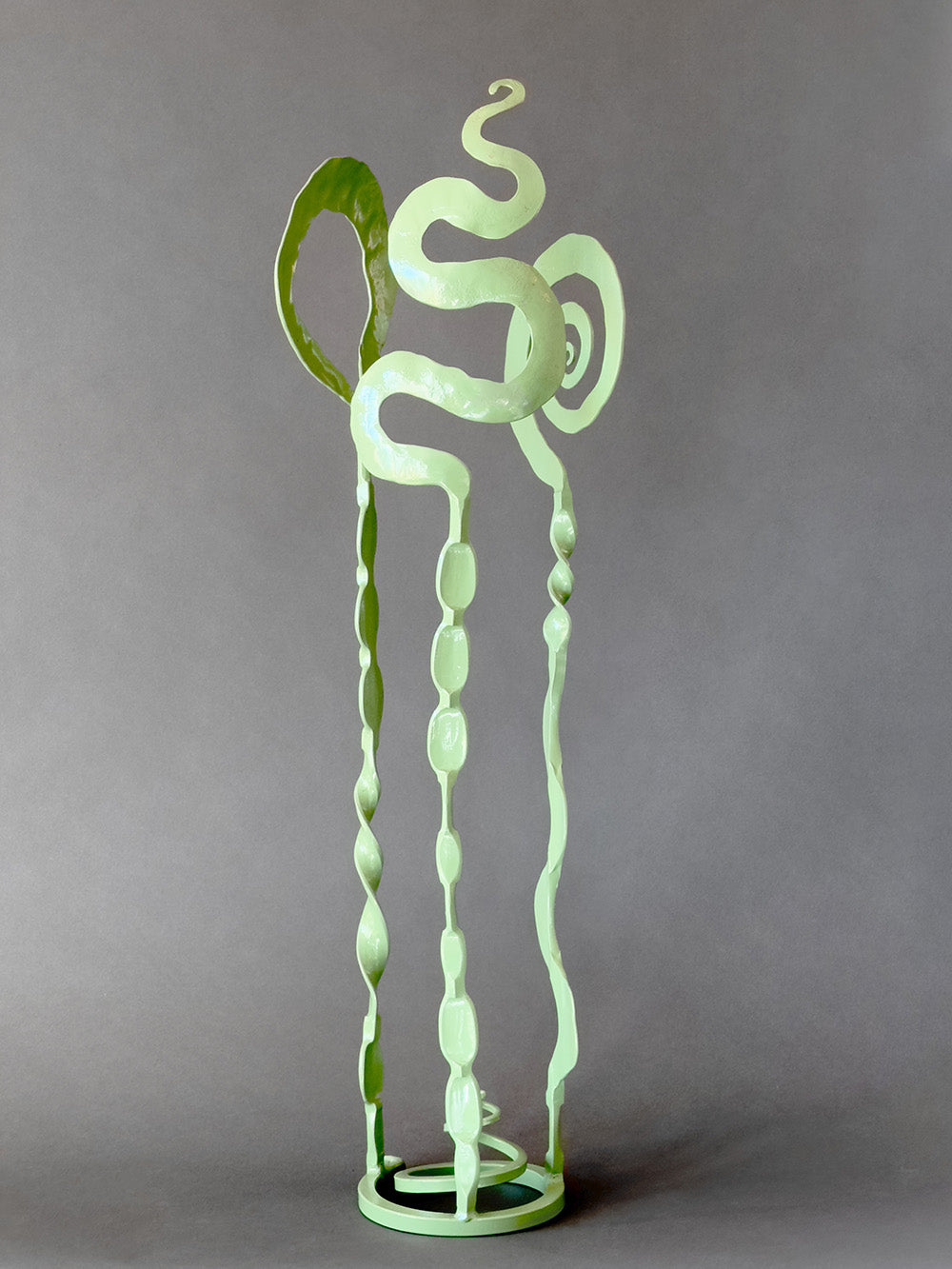 Handcrafted artistic steel sculpture for inside the home or in the garden. Powder-coated sage green.