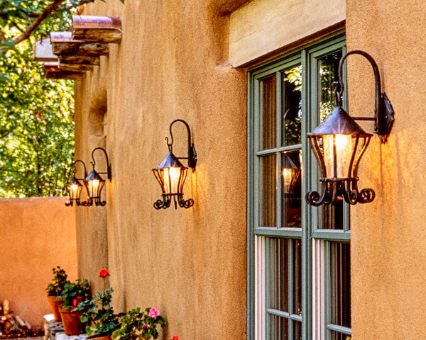 Wrought Iron Lanterns on the exterior of a Santa Fe home. Contemporary Hanging Lantern by New Mexico blacksmith, Chris Thomson