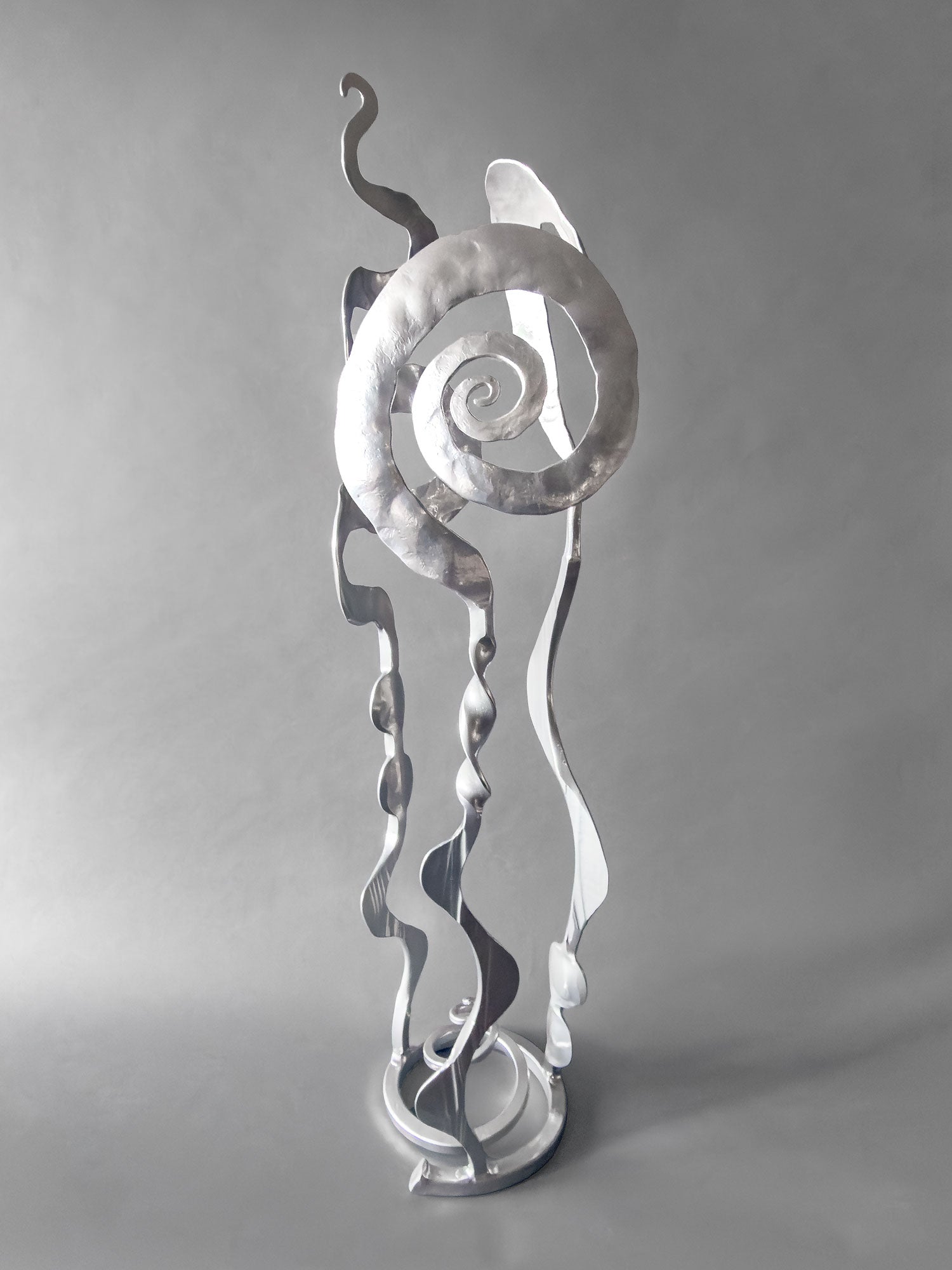 Chrome Baby Bloom hand forged steel sculpture — Rose, Balloon, and Meander forms on a spiral base, front view, 36 inches tall