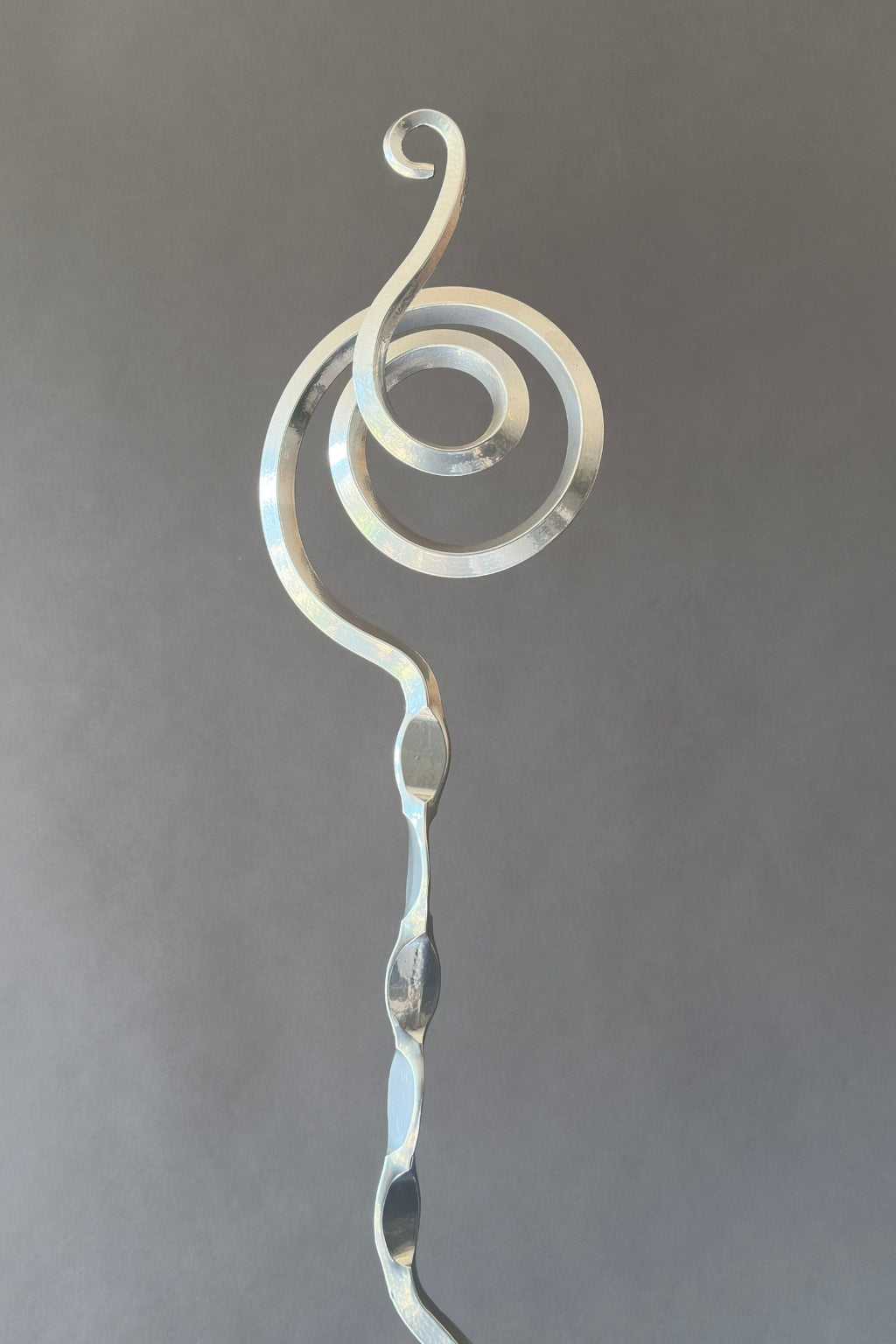 Chrome silver steel sculpture detail