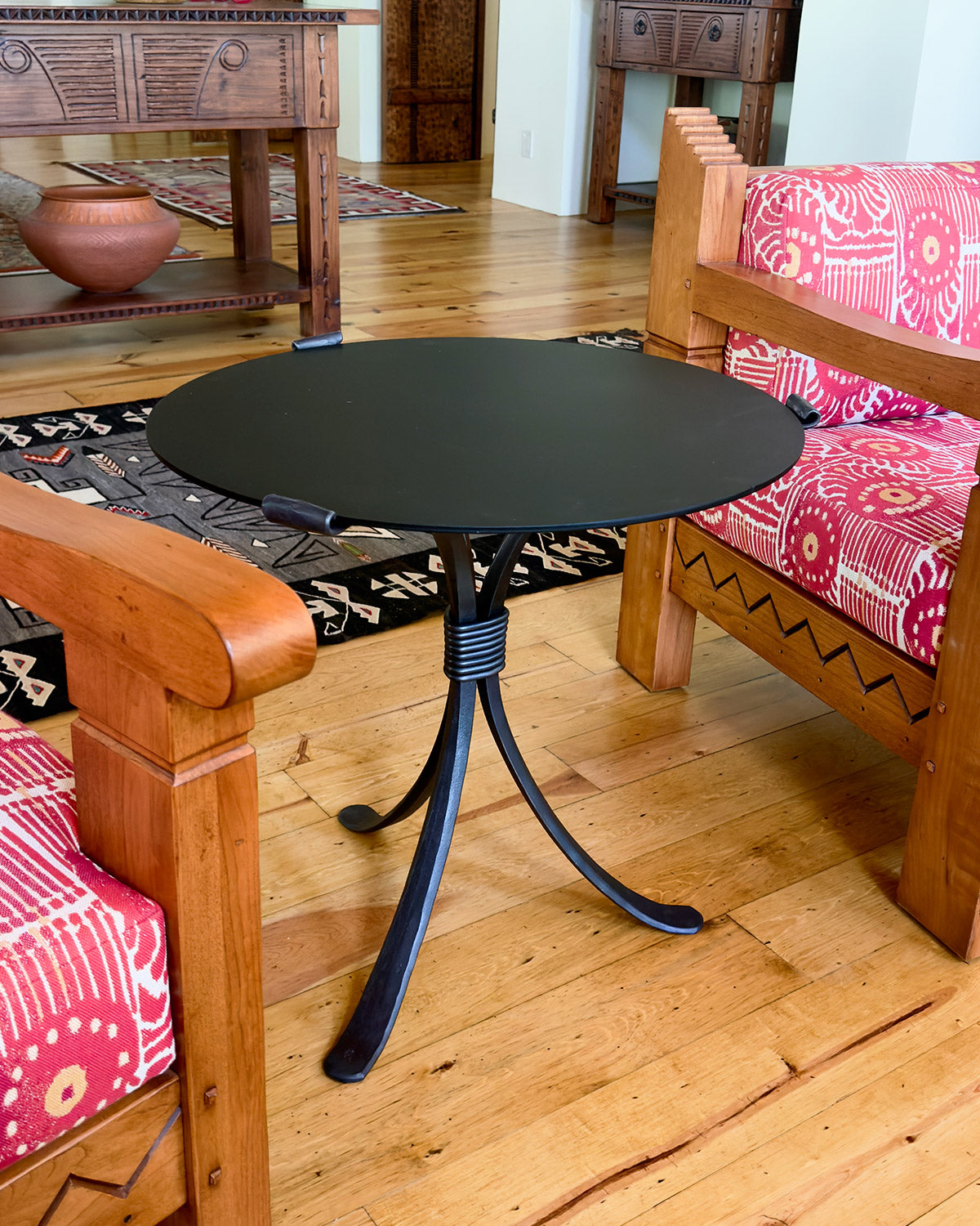 Rustic Black wrought iron end table with a black steel top.