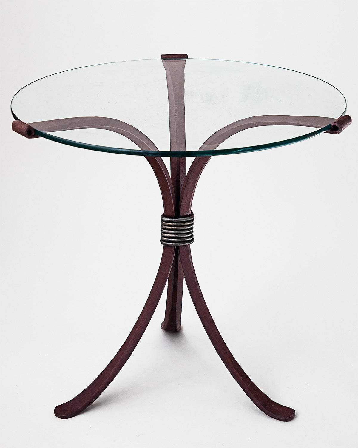 Wrought Iron End Table with a natural rust finish.