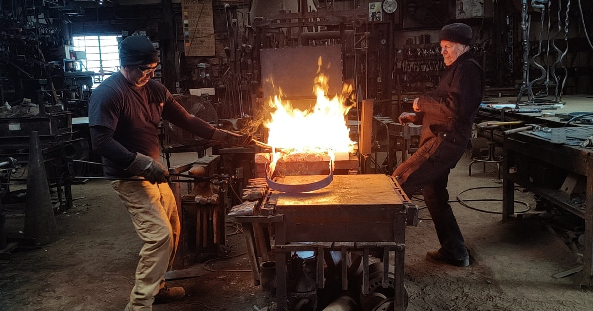 Christopher Thomson and Pedro Cabos, blacksmiths working at the forge in New Mexico.
