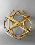 Gold Baby Chinlone orb sculpture, 19 inches, its bundled steel bands woven into an open sphere on a gray backdrop