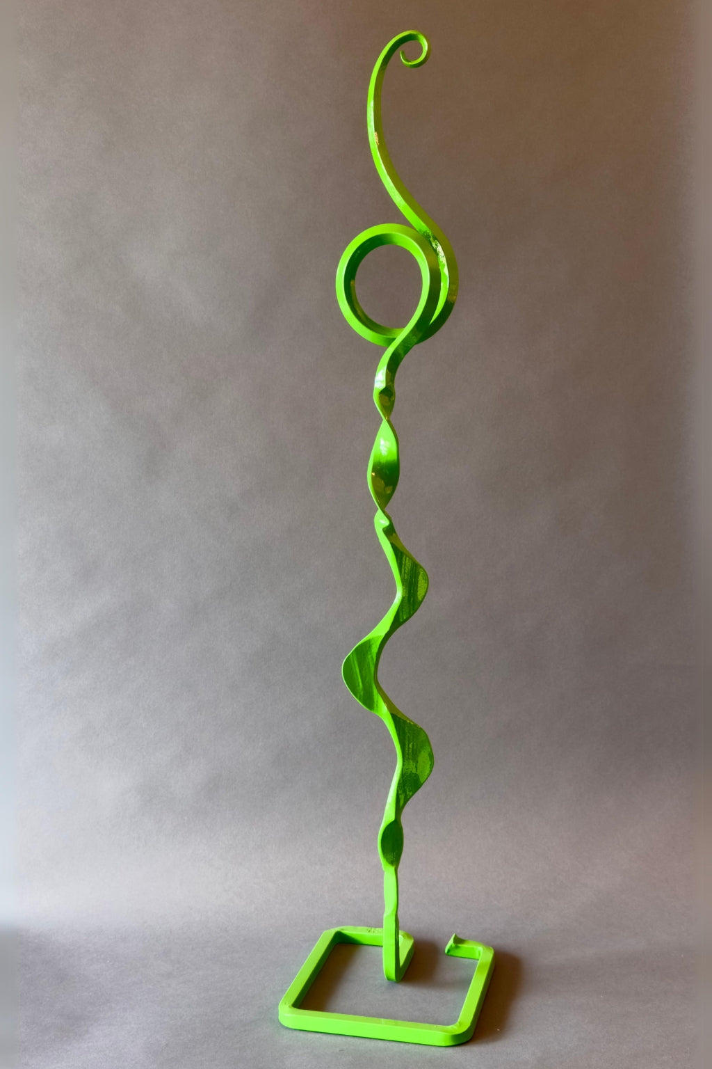 Hand-forged Green Doodle Wisp Mesa Bloom sculpture, featuring whimsical curved metal strands in a verdant finish, designed for outdoor garden décor.