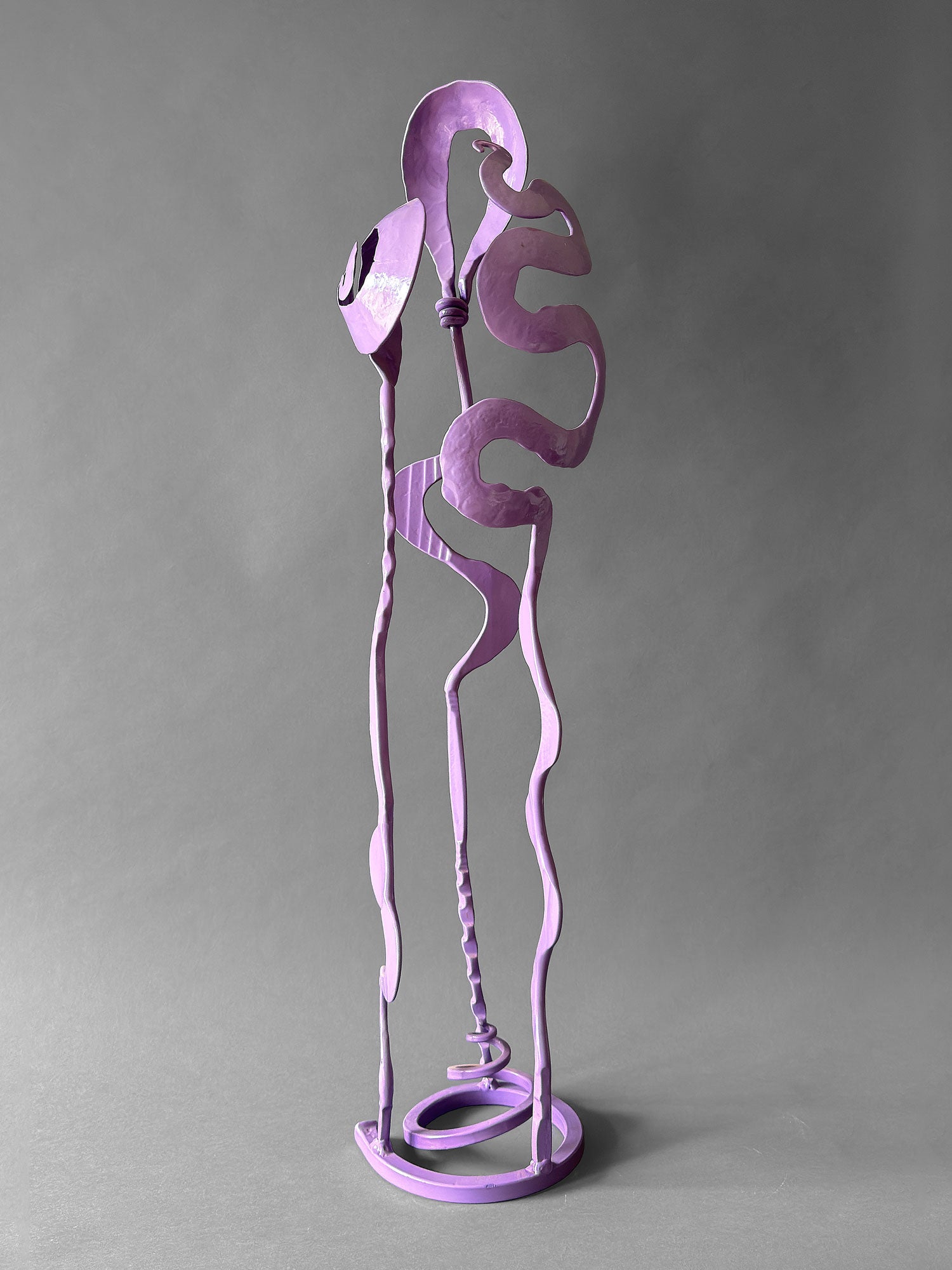 Lavender powder coated hand forged steel Baby Bloom sculpture, 37 inches tall, with Rose, Meander and Balloon forms on circular spiral base, Northern New Mexico