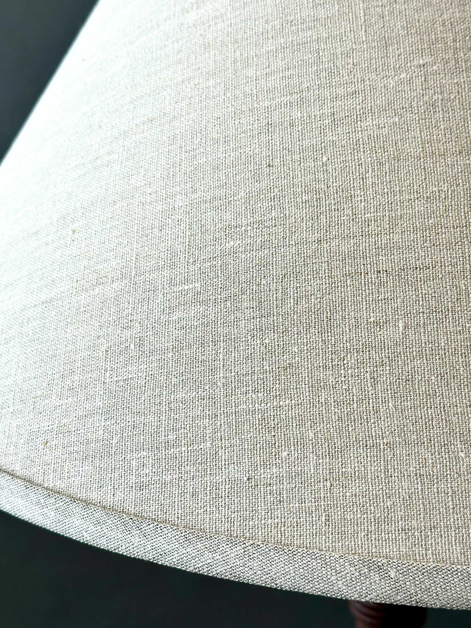 Close up of woven linen lamp shade.
