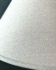 Close up of woven linen lamp shade.