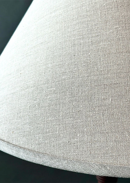 Close up of woven linen lamp shade.